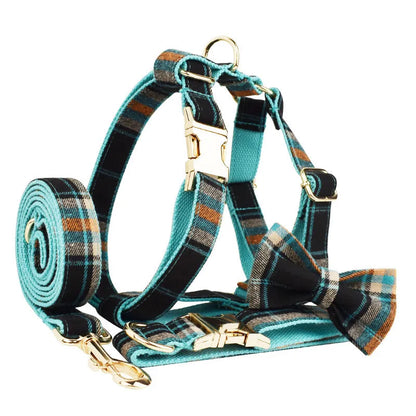 Green retro style cloth dog collar, lead, vest, and bow set displayed together.