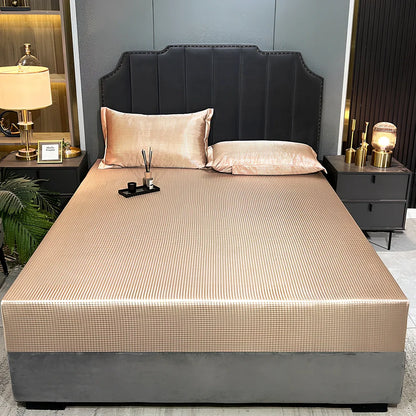 Houndstooth ice silk jacquard fitted three-piece bedding set in ice blue, 180x200cm size with pillowcases on white bed