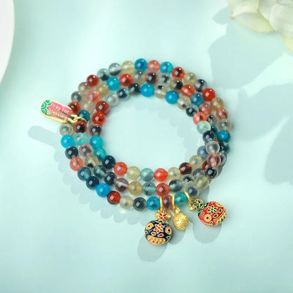 Women's natural agate bracelet with copper coin snake elements in geometric design