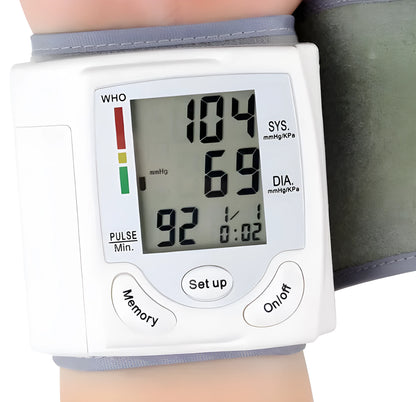 Grey wrist blood pressure monitor with compact design and digital display