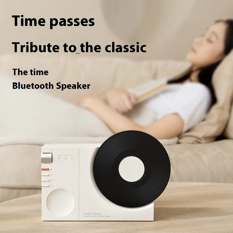 Mini Bluetooth speaker in obsidian black, showing compact design and USB port for charging.
