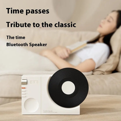 Mini Bluetooth speaker in obsidian black, showing compact design and USB port for charging.