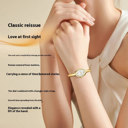 Women's oval retro quartz watch in gold colour with slim 8mm case thickness