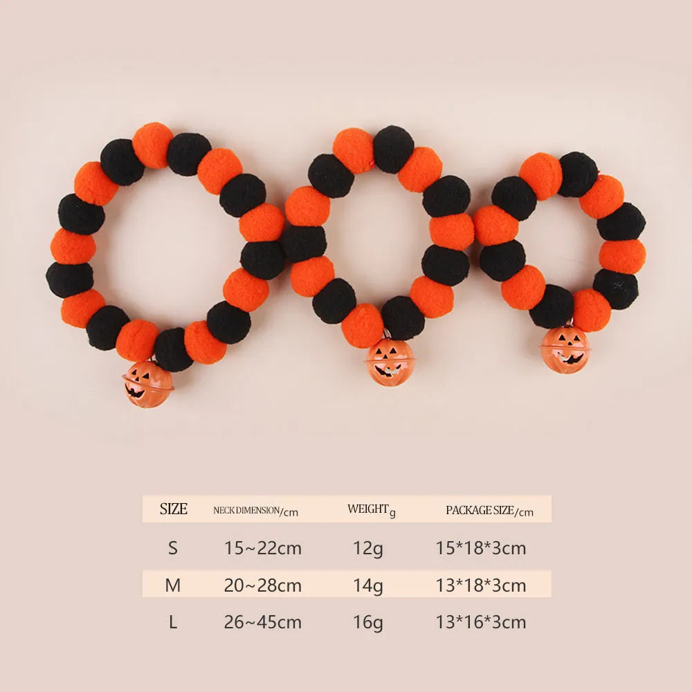 Orange pumpkin-shaped cat collar with a naughty cat face print, laid flat.