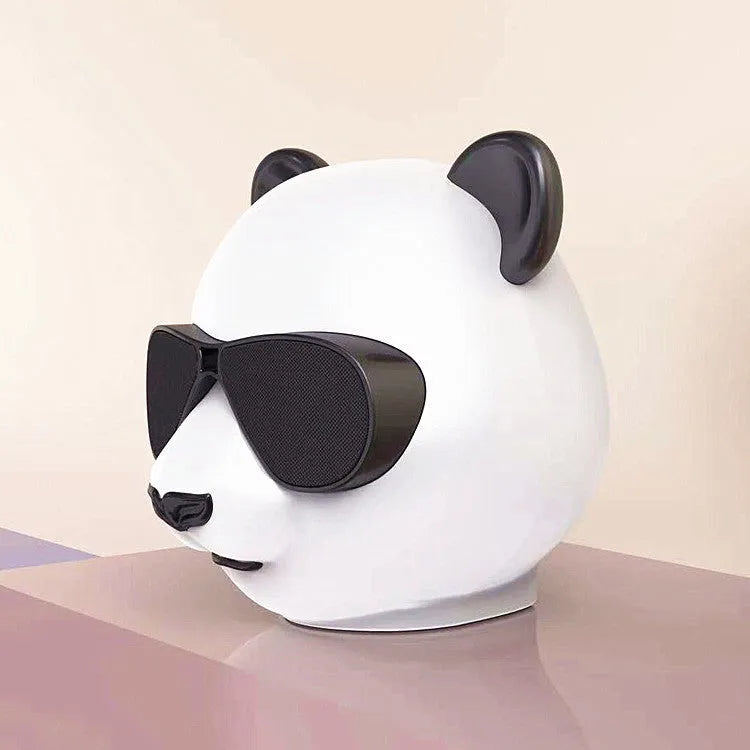 Portable mini Bluetooth speaker with classic style design, showing USB port and approximate 8cm diameter size