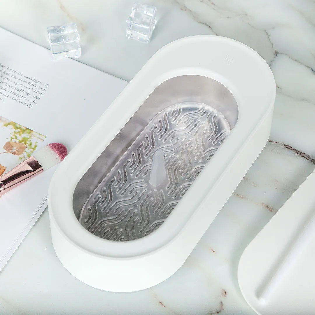 White portable ultrasonic cleaner with stainless steel tank for cleaning jewellery and glasses