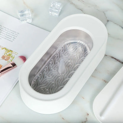 White portable ultrasonic cleaner with stainless steel tank for cleaning jewellery and glasses