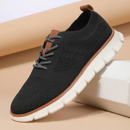 Men's grey and black low-top casual sneakers with a breathable mesh fabric upper.