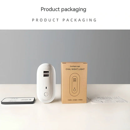 Oval small night lamp with dual USB ports and remote control measuring 50x61x104mm