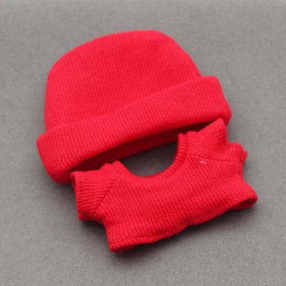 Doll clothes set with knitted flanging hat and T-shirt in multiple colours including pink, white, and stripes.