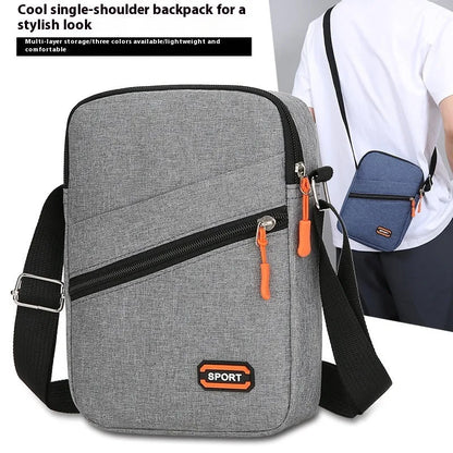 Oxford cloth crossbody commuter bag with contrast colour trim in silver grey