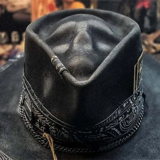 Handmade wool felt skull hat with conical crown design, showing textured surface and distinctive silhouette