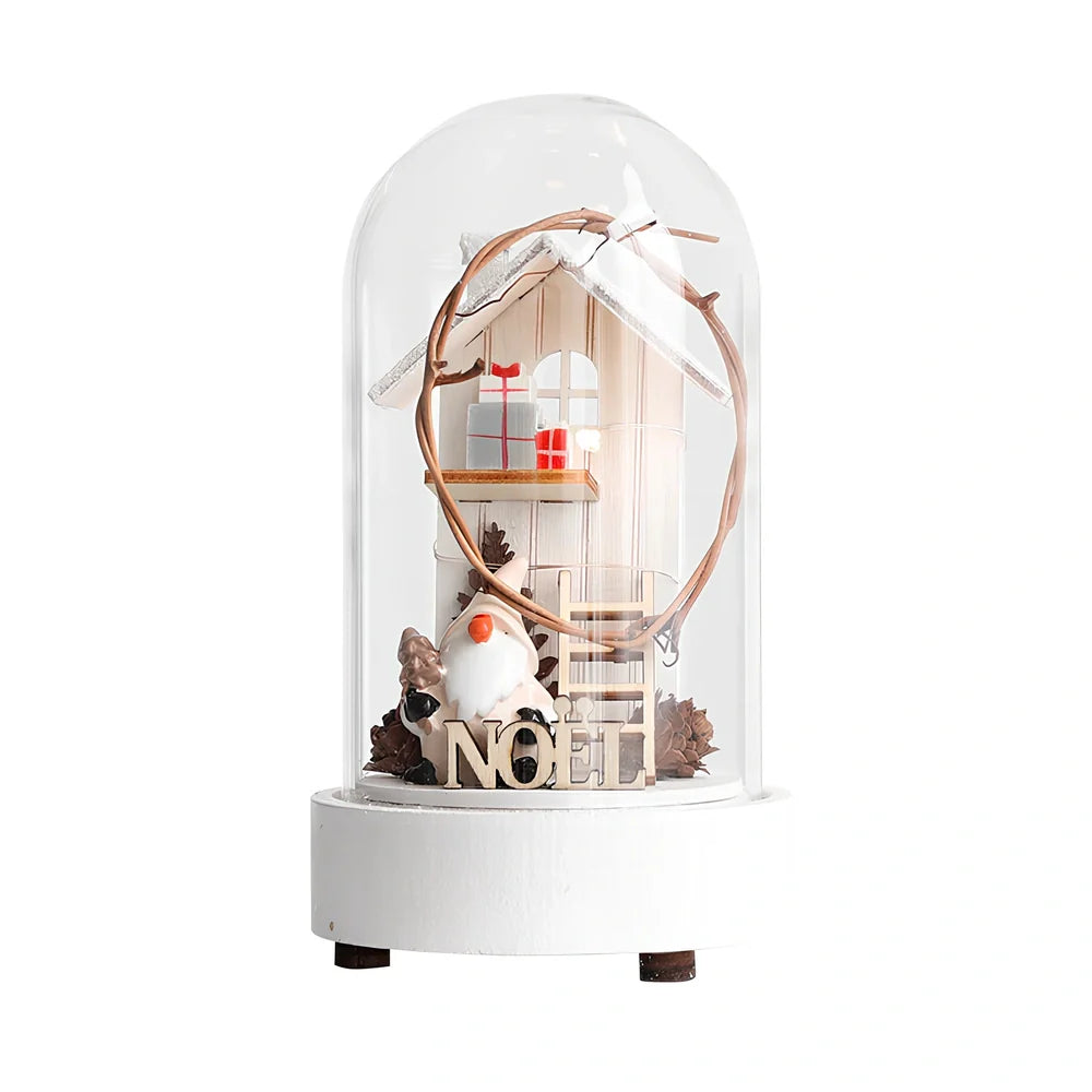 Small 15 cm glass reindeer night lamp in white snowman cabin style casting 100 lumen festive glow on table