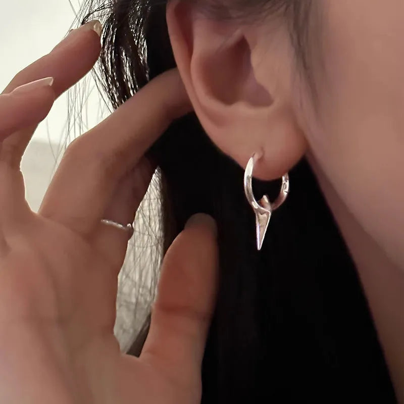 Geometric star-shaped ear clip for women in a platinum electroplated finish.