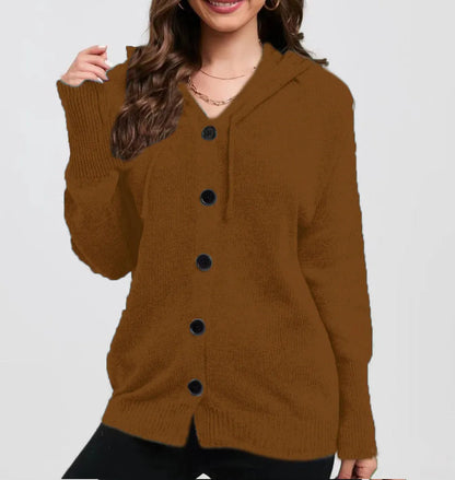 A woman wearing a loose, thick, hooded cotton cardigan in a solid colour.