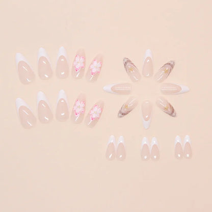 Set of floral French tip false nails with grey rock pattern accents on a simple pink base.