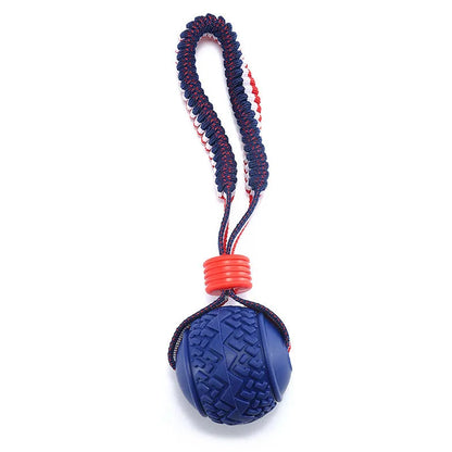 Blue dog ball with rope toy showing 6.5cm textured rubber ball attached to 29cm rope for dental cleaning and tug-of-war