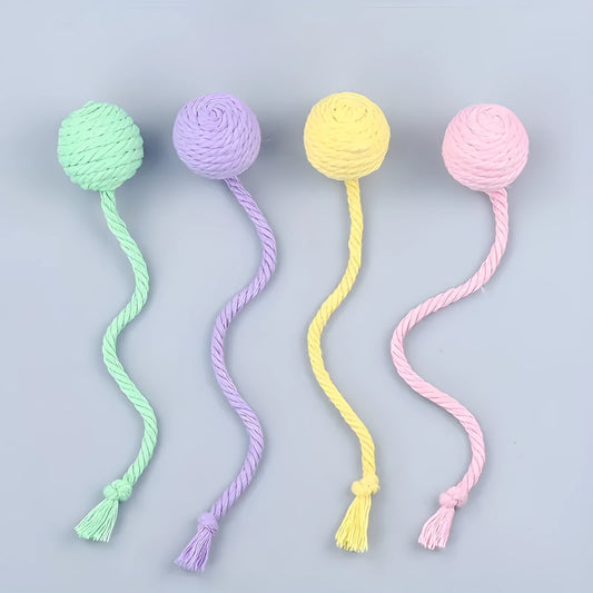 Interactive cat toy ball with bell and rope in green, pink, purple or yellow colours, shown in 3cm and 6cm sizes
