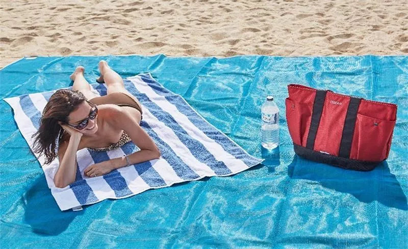 Sand-free beach mat in green, blue, or pink, made from durable PVC for easy cleanup