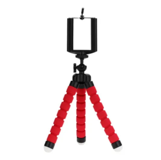 Black flexible octopus tripod stand wrapped around a branch holding a smartphone for angled video capture
