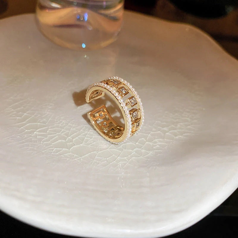 Elegant pearl hollowed-out square open-end zircon ring for women, fashion jewelry with geometric design.