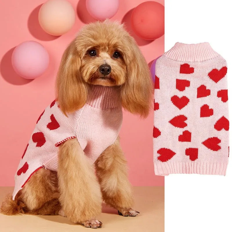 Red love heart pattern dog sweater with pink bow decoration on small dog