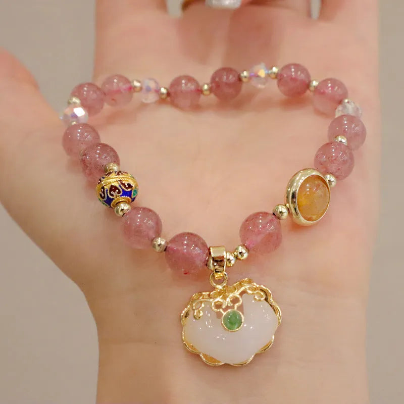 Geometric ethnic style jade bracelet for women with metal charm decoration in gray or strawberry quartz.