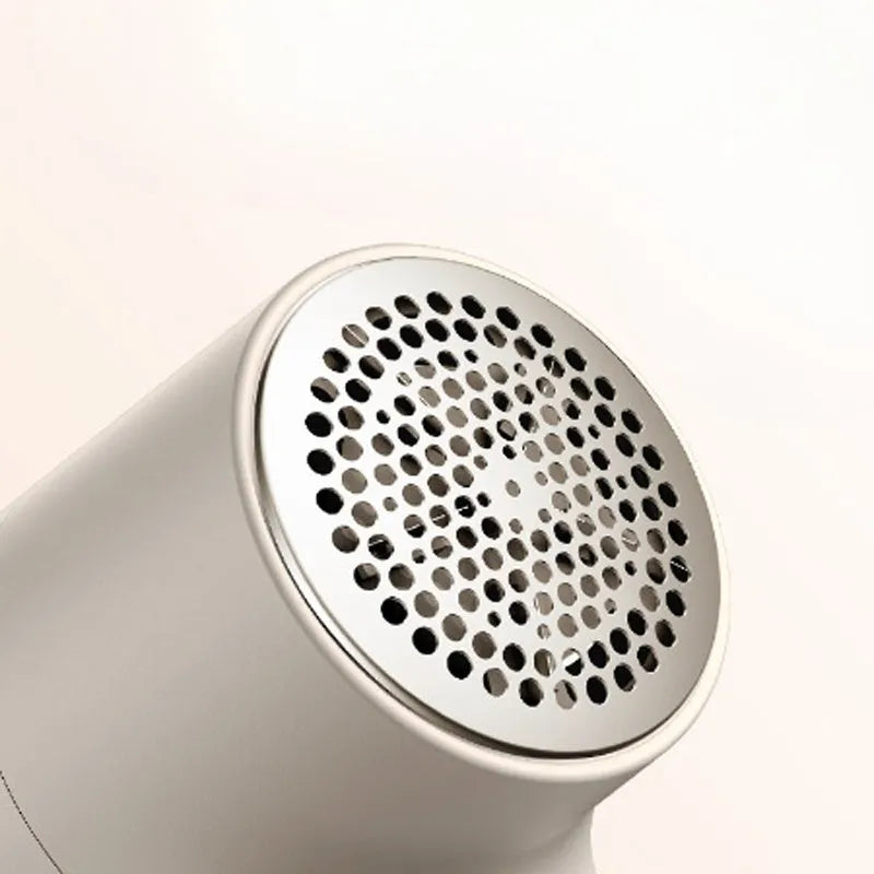 White electric lint remover with LED display showing fabric shaver dimensions 126x73x68mm