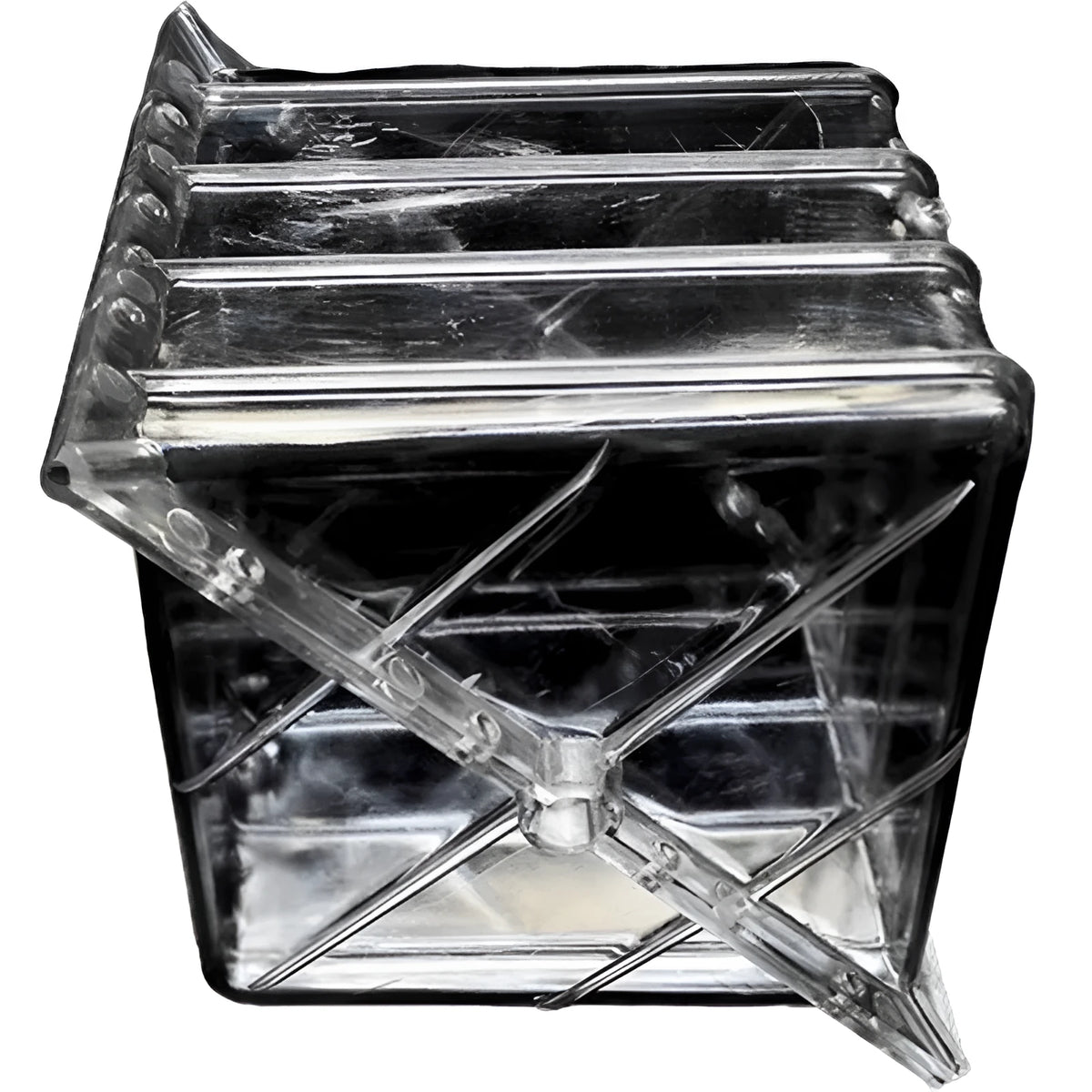 A square white plastic mould for growing square watermelons and fruit, measuring 13cm on each side.