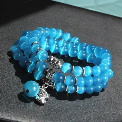 Women's opal crystal bracelet with lucky cat charm and geometric design, shown in blue colour option