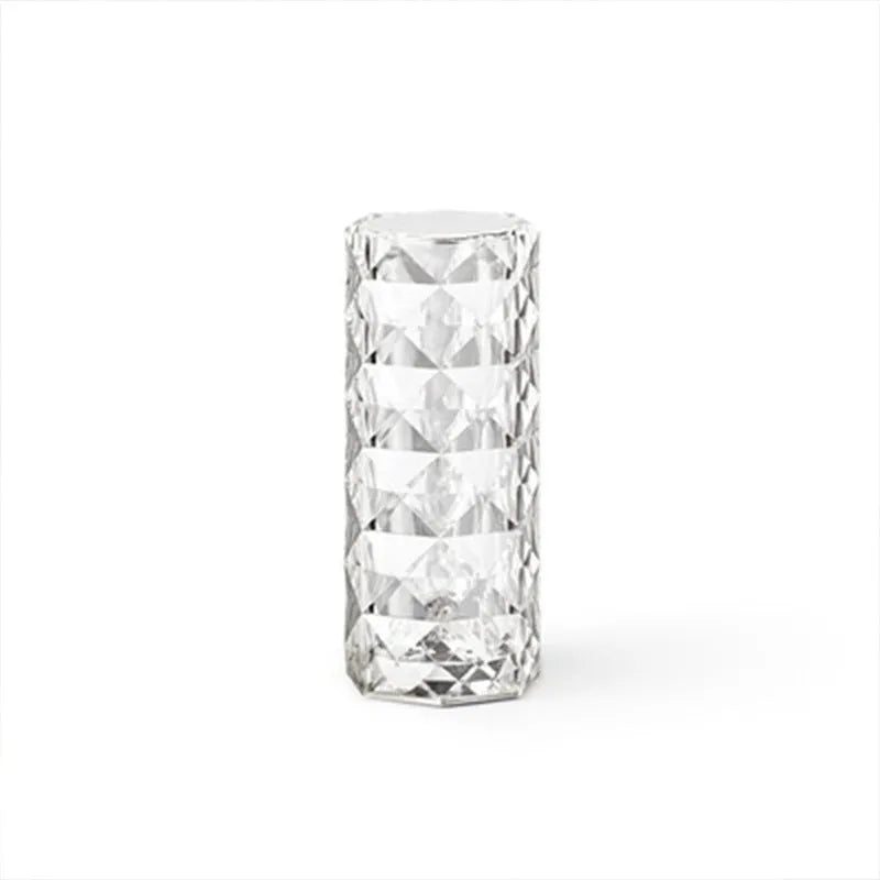 Modern minimalist acrylic crystal rose LED table lamp with touch switch on a wooden table.