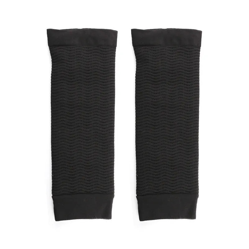 Women's black nylon shaping arm sleeve, free size, laid flat.
