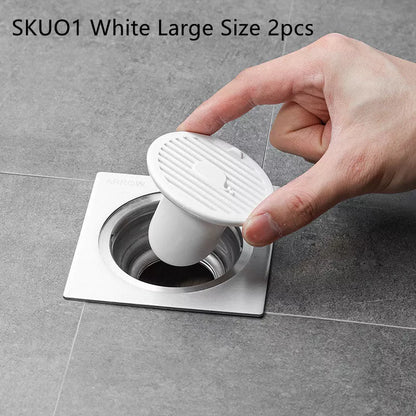 Whale Magnetic Suction Floor Drain Cover in white, orange, or green, blocking sewer odors with a tight seal