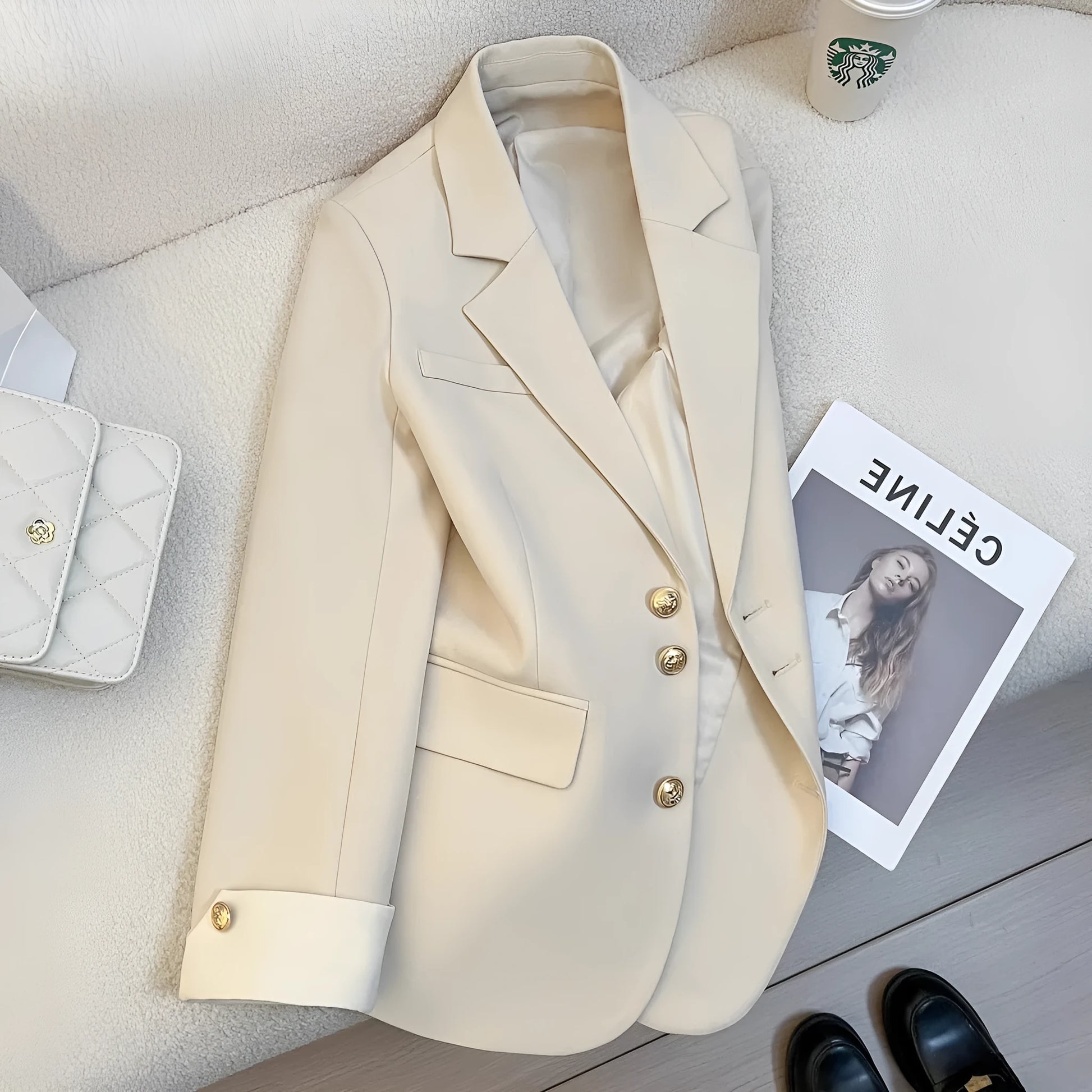 Milky white loose fit Korean-style women's coat with long sleeves and pockets.