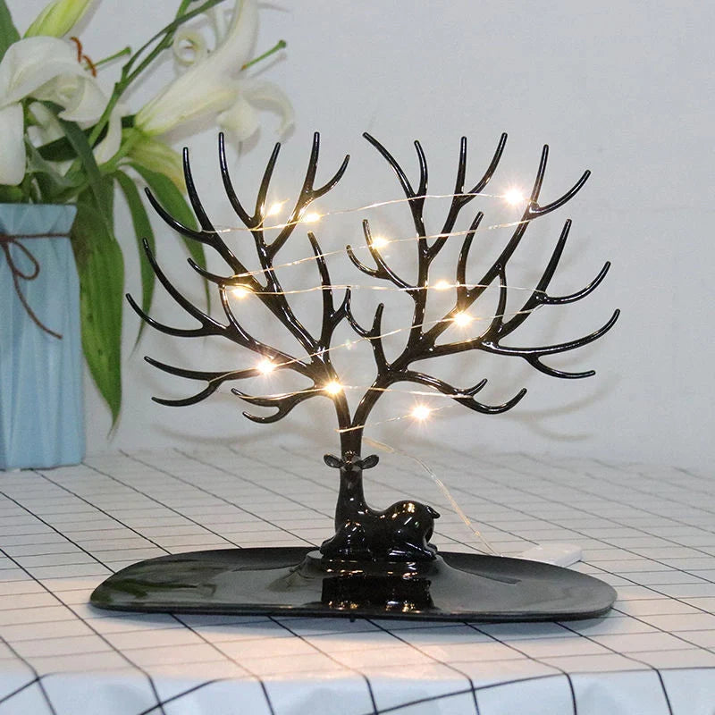 Deer Antler Jewelry Stand in white and black, organizing earrings, necklaces, and bracelets