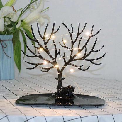 Deer Antler Jewelry Stand in white and black, organizing earrings, necklaces, and bracelets