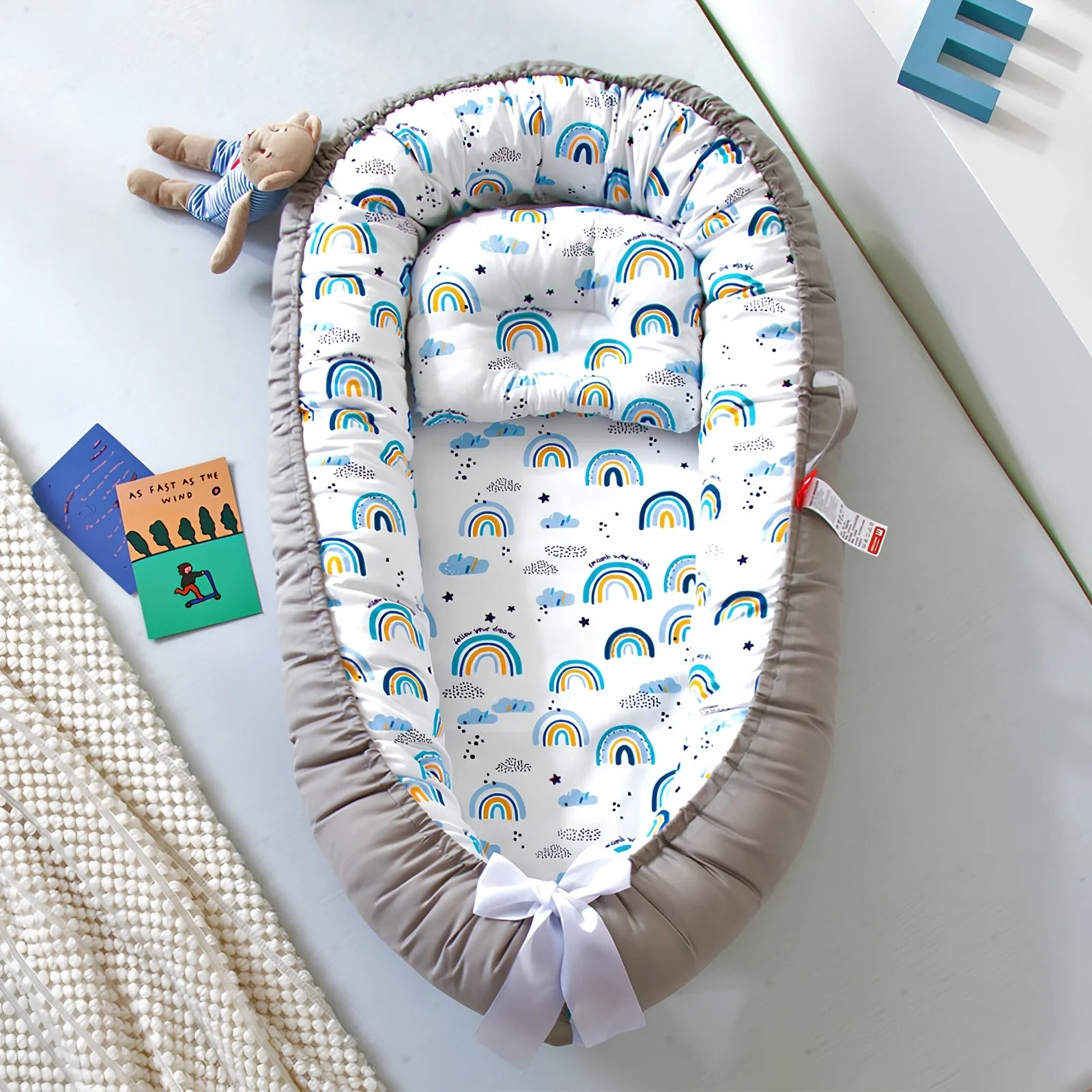 Portable foldable baby bed measuring 85x45cm with cartoon pattern, shown in green elk design