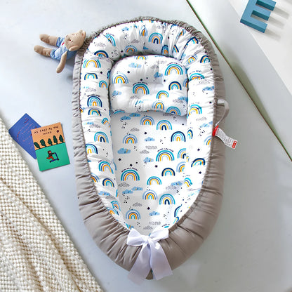 Portable foldable baby bed measuring 85x45cm with cartoon pattern, shown in green elk design