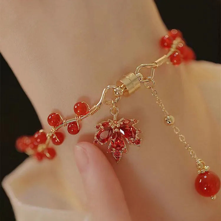 Red ginkgo leaf charm on an alloy magnetic bracelet with a natural Chinese style.