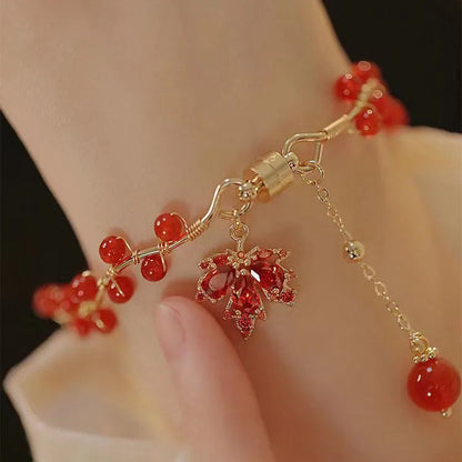 Red ginkgo leaf charm on an alloy magnetic bracelet with a natural Chinese style.