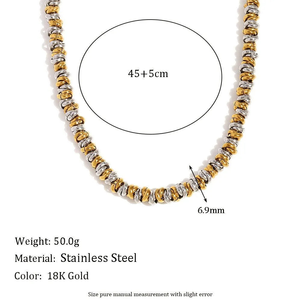 Gold electroplated stainless steel earrings, necklace, and bracelet set with geometric shapes and round ring elements