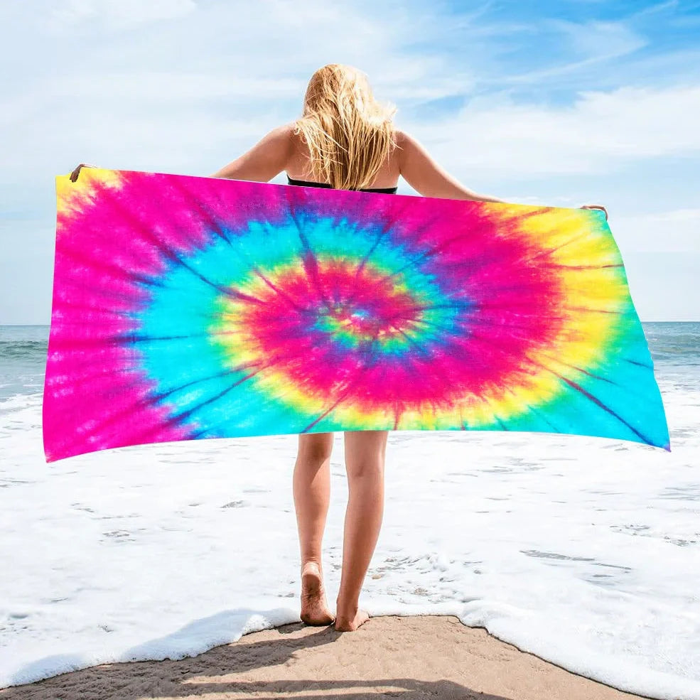 Square beach towel with tie-dye pattern showing superfine fibre texture and vibrant colours