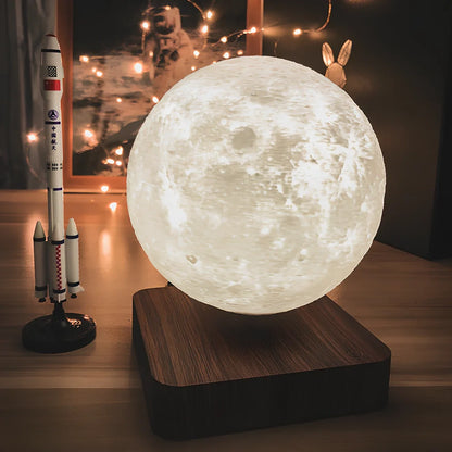 Magnetic levitation moon lamp with spherical design floating above base, showing three light colour modes