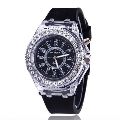 Women's LED luminous quartz watch with silicone strap and round alloy case on wrist