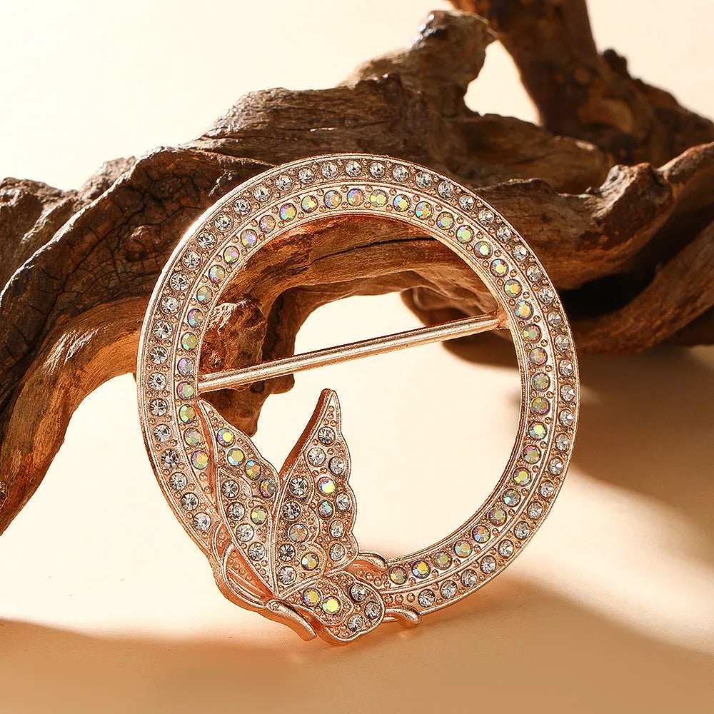 Bow-shaped waist-cinching accessory clip for high-end brooches, alloy with electroplating and diamond inlay, shown in gold, silver, or rose gold finishes.