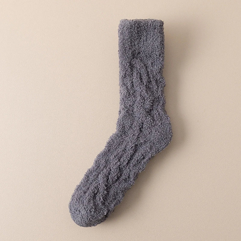 Cozy coral fleece socks in various colors, designed for superior comfort and warmth