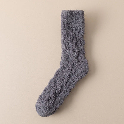 Cozy coral fleece socks in various colors, designed for superior comfort and warmth