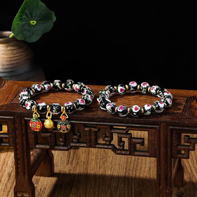 Handmade glass bracelet with 10mm swallowing gold beast cherry blossom heart charm in six colour options
