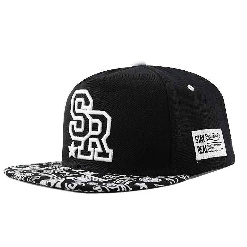 Cotton baseball hat with letter embroidery showing dome crown and adjustable strap in black and white colour options