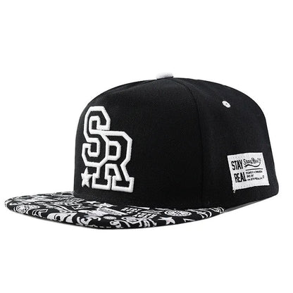Cotton baseball hat with letter embroidery showing dome crown and adjustable strap in black and white colour options